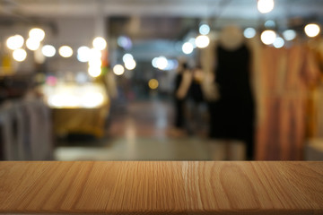 Empty dark wooden table in front of abstract blurred bokeh background of restaurant . can be used for display or montage your products.Mock up for space.