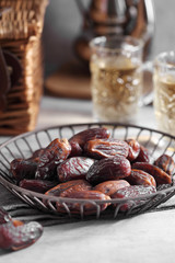 dates fruit and Arab tea on a white concrete background with a blank space for a text, dates fruit on a white background