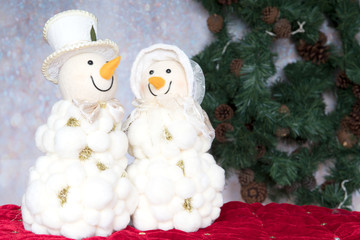 Happy smiling snowman couple. Snowwoman. Christmas Decoration