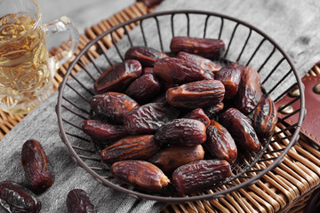 dates fruit and Arab tea on a white concrete background with a blank space for a text, dates fruit on a white background
