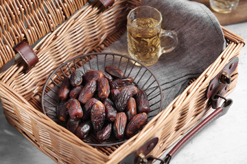 dates fruit and Arab tea on a white concrete background with a blank space for a text, dates fruit on a white background