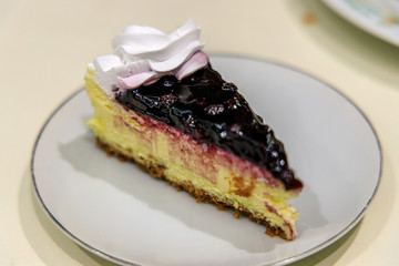 blueberry cheese cake on the white plate
