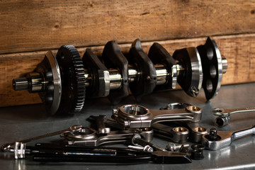 motorcycle engine parts on a workbench with some tools