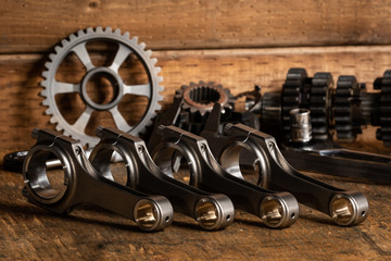 motorcycle engine parts on a workbench with some tools