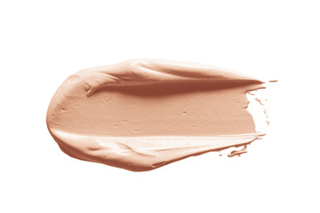 Makeup foundation, concealer swatch smudge smear isolated on white background. Nude make up base...