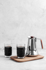Coffee in cup and moka pot on rustic table with a blank space for a text, Espresso in cup on white background