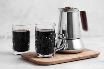 Coffee in cup and moka pot on rustic table with a blank space for a text, Espresso in cup on white background
