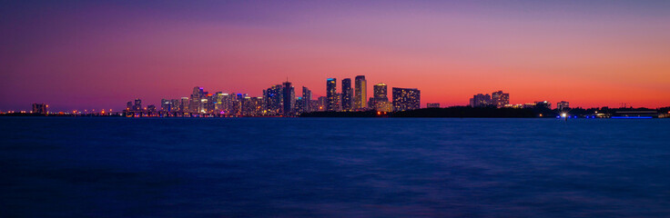 panoramic view of sunset orange sky blue sea buildings city miami