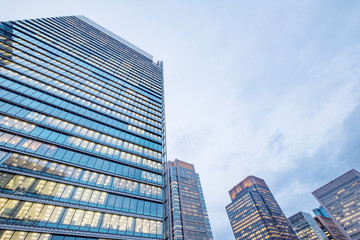 Fototapeta na wymiar Windows of skyscraper business office buildings, Corporate building in Tokyo City, Japan. Business concept.