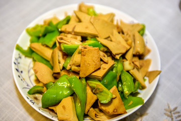 Traditional Chinese dishes: stir fried dried tofu slices with chili