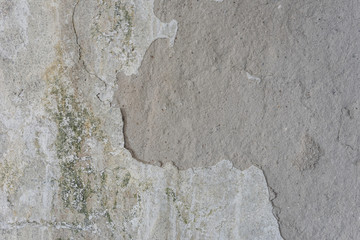 Old gray damaged cracked stone wall background