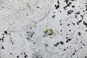 Texture of a concrete wall with cracks and scratches which can be used as a background