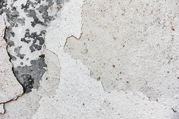 Texture of a concrete wall with cracks and scratches which can be used as a background