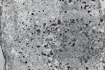 Texture of a concrete wall with cracks and scratches which can be used as a background