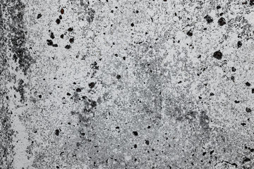 Texture of a concrete wall with cracks and scratches which can be used as a background