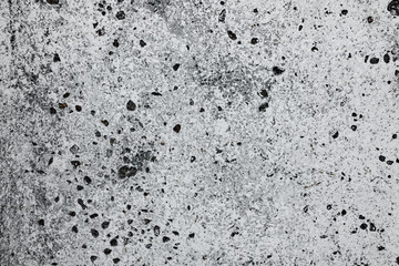 Texture of a concrete wall with cracks and scratches which can be used as a background