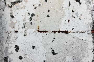 Texture of a concrete wall with cracks and scratches which can be used as a background