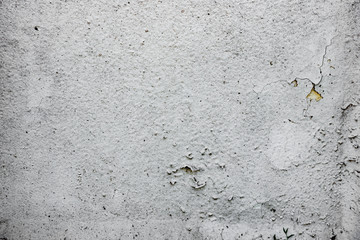 Texture of a concrete wall with cracks and scratches which can be used as a background