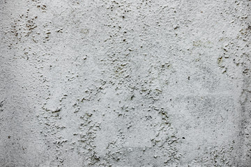 Texture of a concrete wall with cracks and scratches which can be used as a background