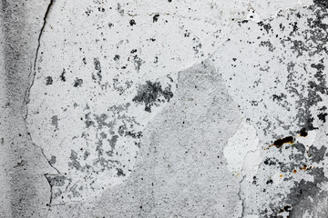 Texture of a concrete wall with cracks and scratches which can be used as a background