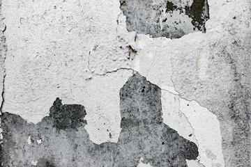 Texture of a concrete wall with cracks and scratches which can be used as a background