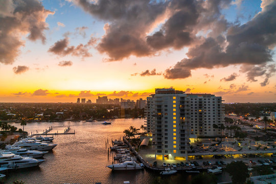 Aerial View Of Fort Lauderdale Waterway Canals, Residential Homes And Skyline At Sunset