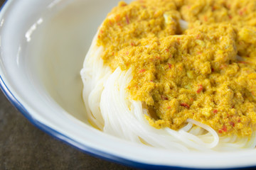 Close up of thai rice noodles with fish curry sauce