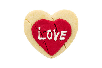 broken heart cookie with love text isolated on white background