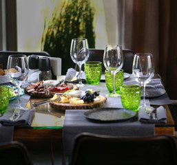 Photo fragment of the interior of the table with glasses