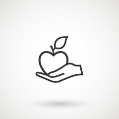 Apple in hand icon. Hand holding an apple, logo on white background.