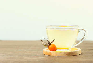 cup of hot rose hip drink, healthy relaxation tea