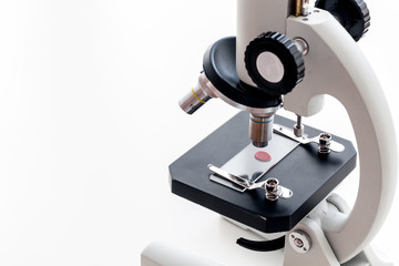 Blood testing. Samples viewing under microscope on white background top view space for text