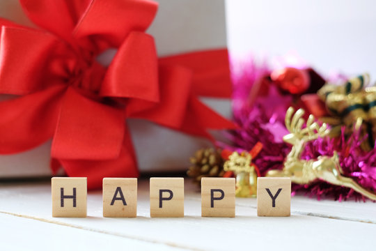 Wooden letter word "happy"  with christmas gift boxing and x mas's decorations background. Christmas's day concept.