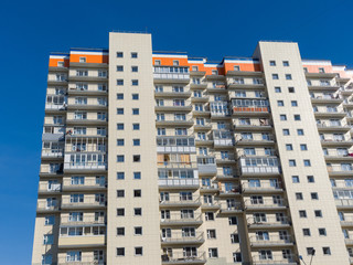 Modern residential development. Fragment of the building. The theme of an emerging housing market...