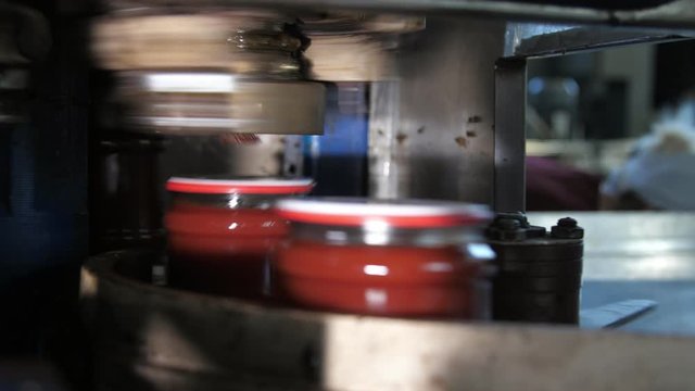 Tomato paste banks moving on a metallic stripe under a rolling robot in a plant