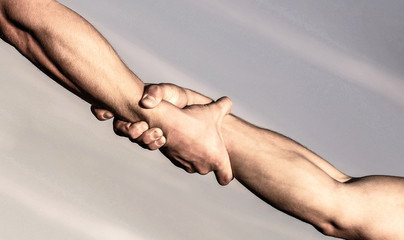 Helping hands concept, support. Close up help arm. Helping hand concept and international day of...