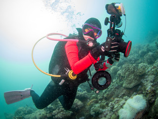 Scuba diver doing underwater photography in Anilao Philippines