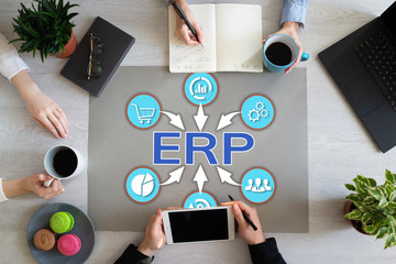 ERP enterprise resource planning business automation technology on office desktop.