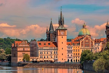 Fototapeta premium Scenic summer evening view of the Old Town ancient architecture and Vltava river pier in Prague, Czech Republic