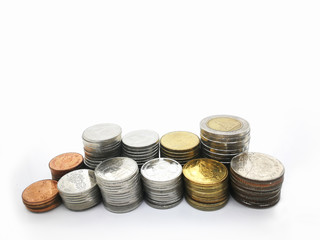 Overlay and stack many coins like graph on white background for financial concept.