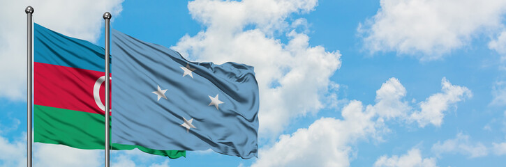 Azerbaijan and Micronesia flag waving in the wind against white cloudy blue sky together. Diplomacy concept, international relations.