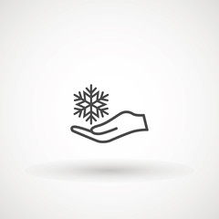 Vector hand and snowflake icon, logo on white background. Hand holding snowflake icon