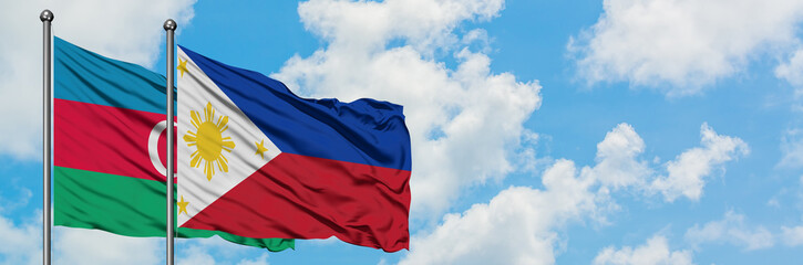 Azerbaijan and Philippines flag waving in the wind against white cloudy blue sky together. Diplomacy concept, international relations.