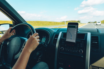 woman hands on steering wheel close up