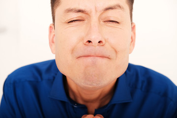 Fototapeta premium Closeup Studio portrait of handsome man in blue shirt 