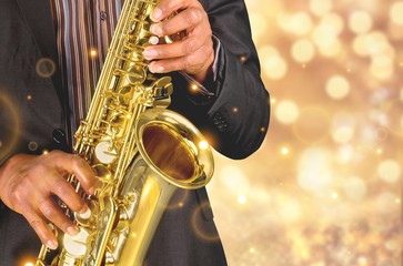 Obraz premium Saxophone player Saxophonist playing jazz music instrument