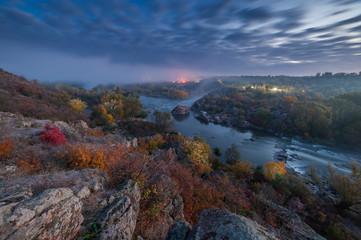 Fall landscape with river on sunrise