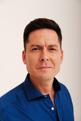 Fototapeta premium Studio portrait of handsome man in blue shirt 