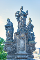 Fototapeta na wymiar Sculptural group depicting Saint Barbara Saint Margaret and Saint Elizabeth of Hungary. By Ferdinand Brokoff On the Carlo Bridge in Prague
