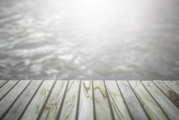Wooden decking scene that stretches out into the water